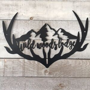 Laser cut powder coated Wild Woods Lodge sign